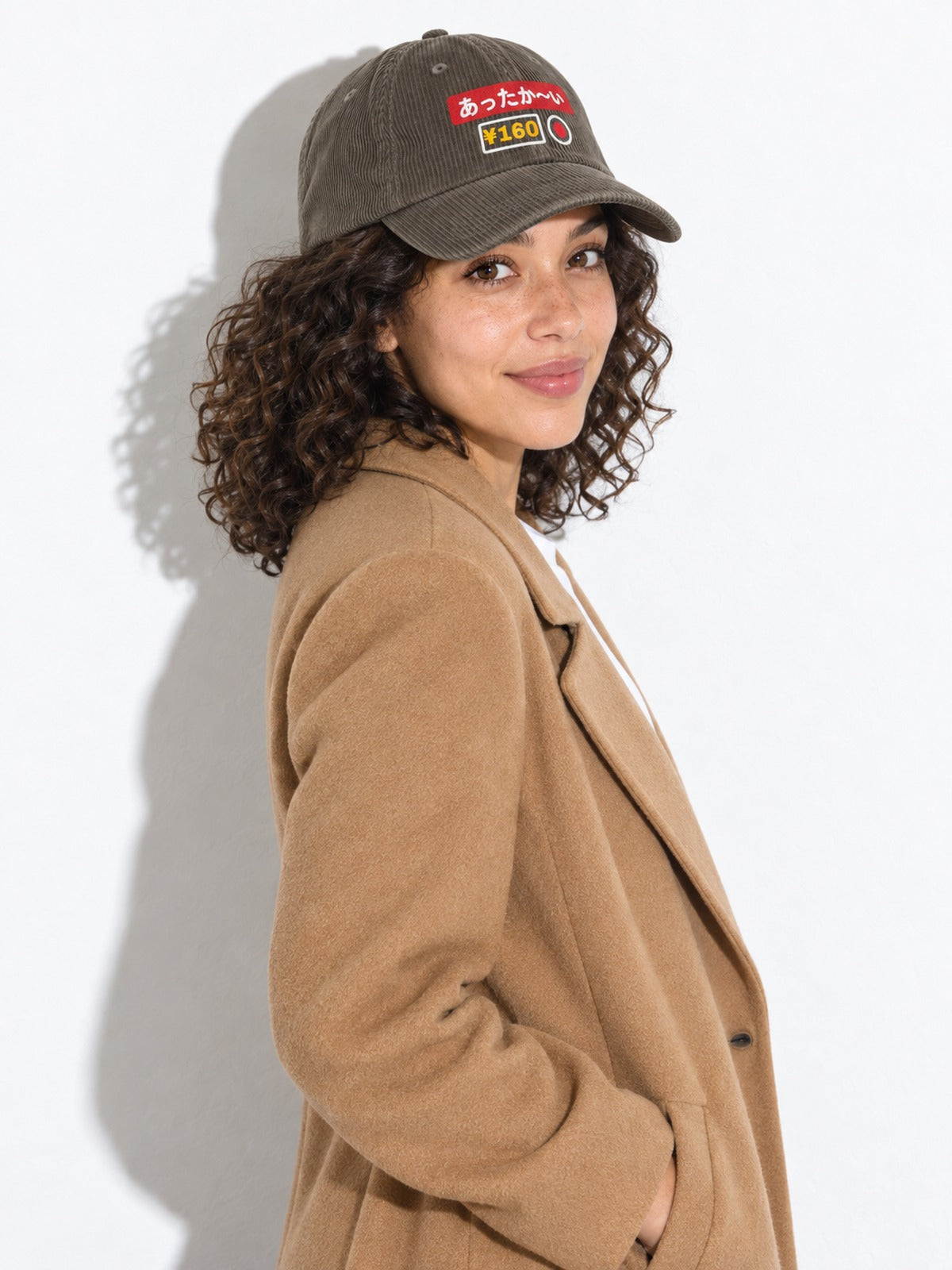 Attaka-i corduroy cap, olive, over-the-shoulder