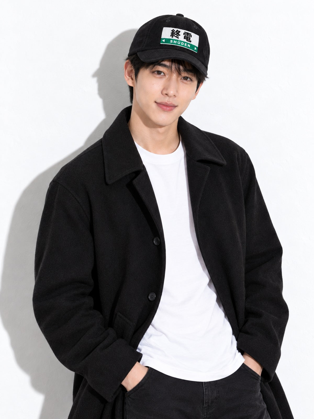 Shūden corduroy cap, black, waist-up