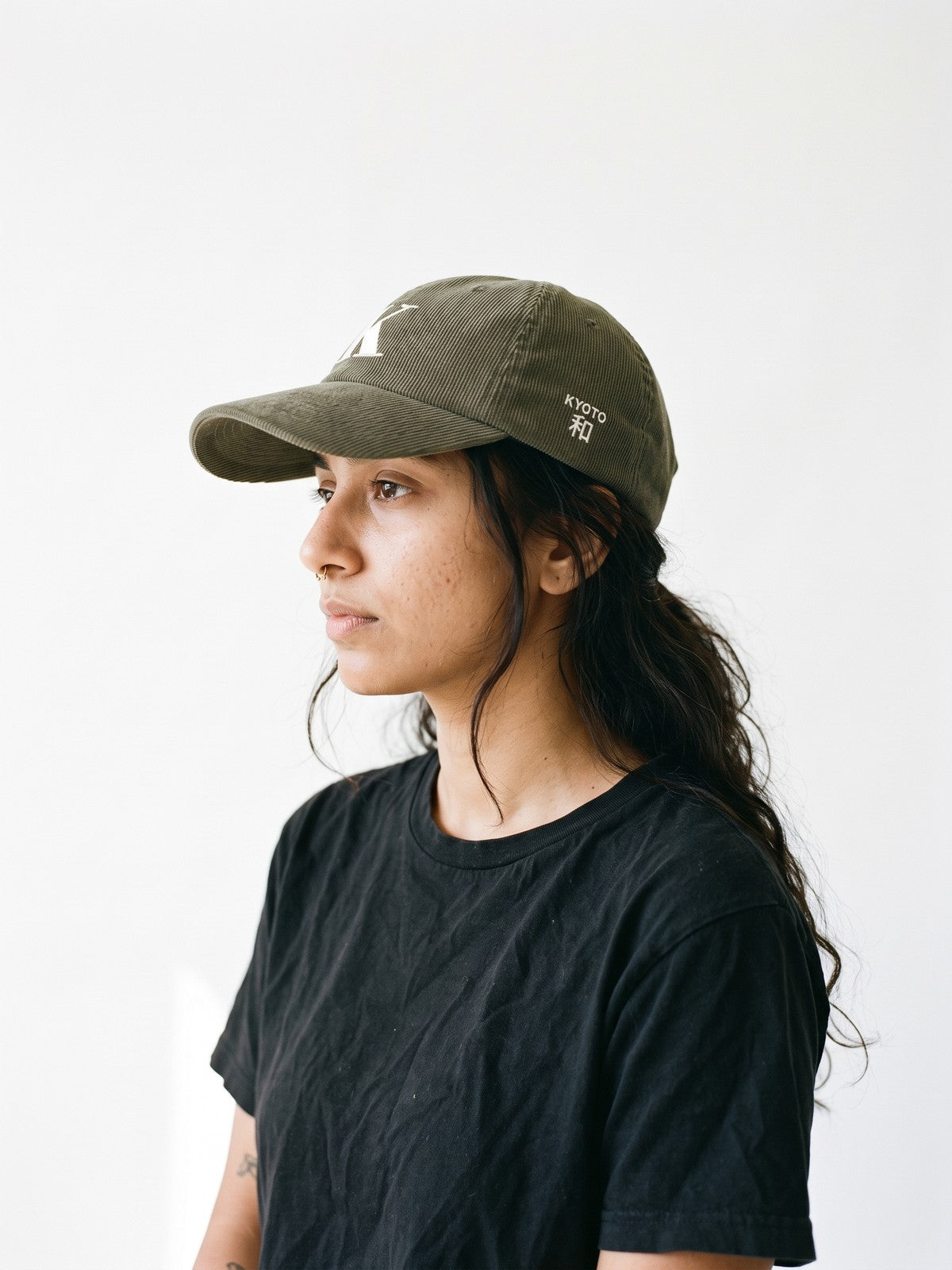 Side view of the 5C5V Kyoto K Corduroy Japanese baseball cap in olive, KYOTO above 和 (harmony) embroidered on the left side
