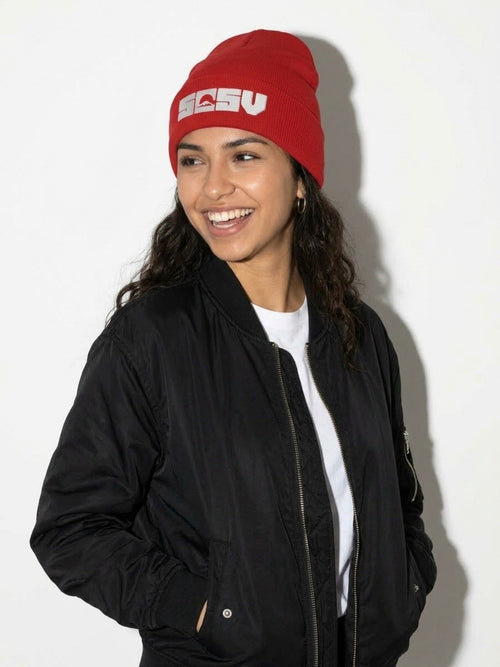 Laughing model in a black bomber jacket wearing the red 5C5V Originals cuffed beanie with white embroidered Mt Fuji logo