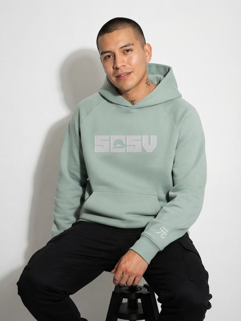 5C5V Originals 元 heavyweight Japanese hoodie in Arona sage green, seated studio shot