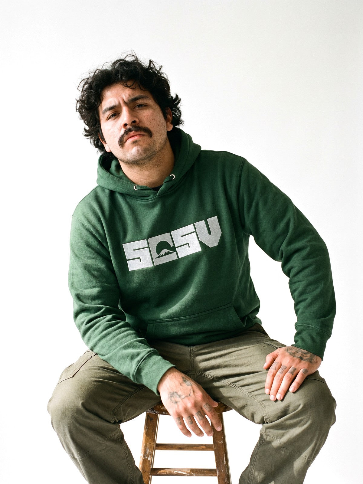 5C5V Originals hoodie in forest green, worn on a white background