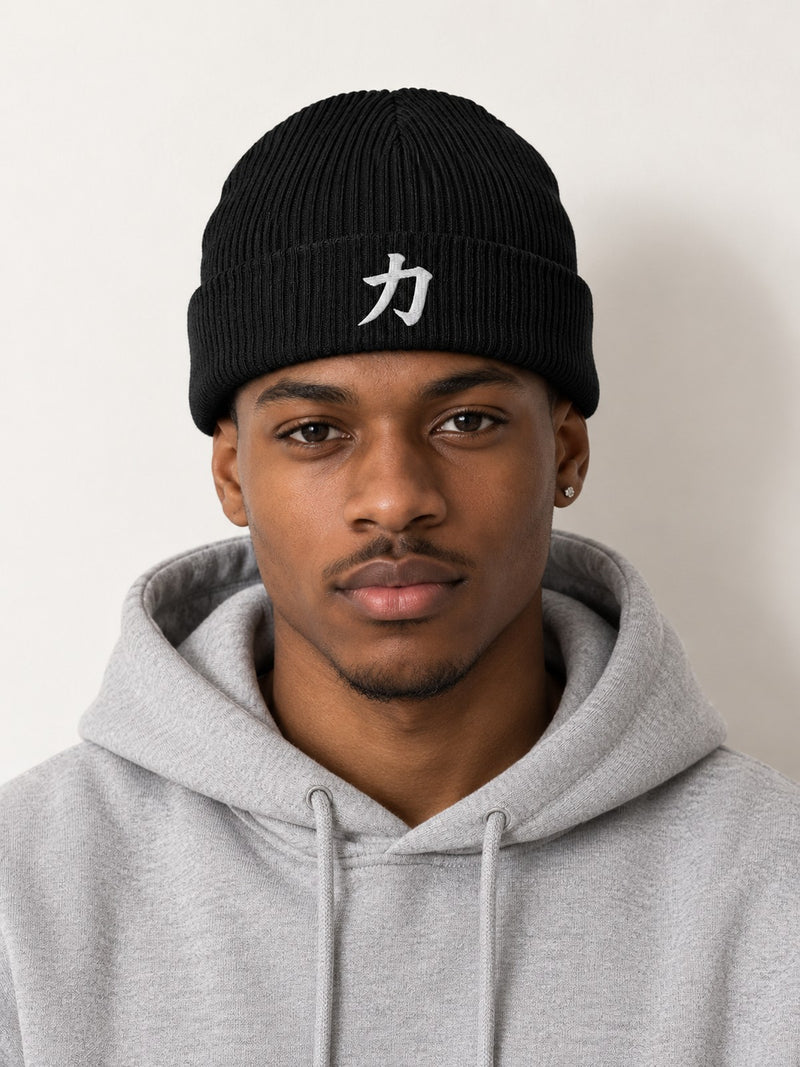 Model in a grey hoodie wearing the black 5C5V Osaka Strength organic beanie with 力 embroidered in white on the cuff, front view