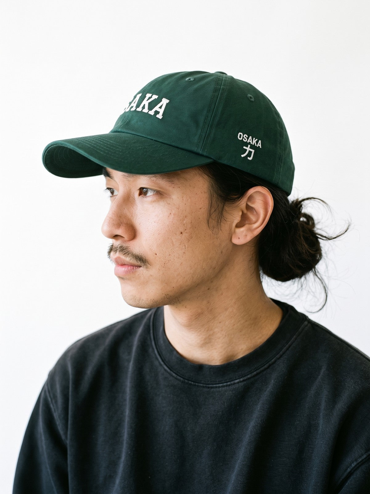 Side view of the 5C5V Osaka Varsity Japanese baseball cap in spruce, OSAKA above 力 (strength) embroidered on the left side