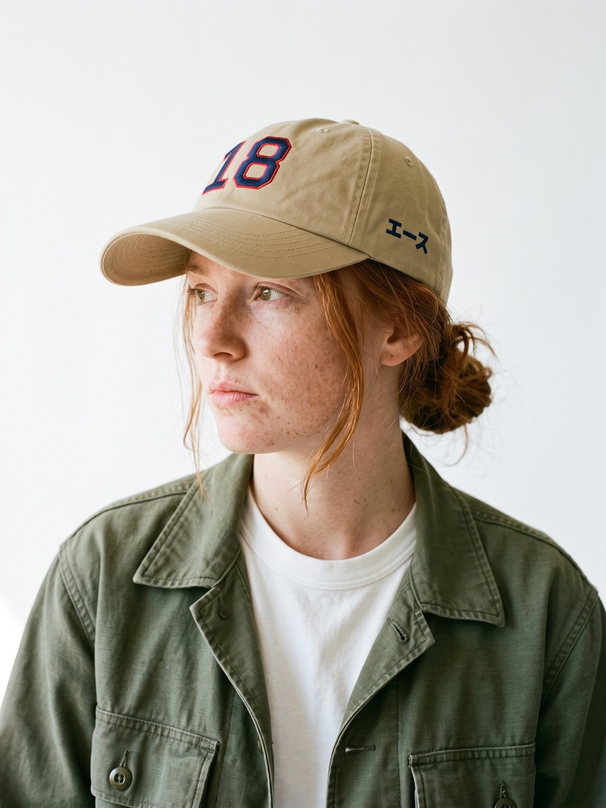 Side view of the 5C5V Ace 18 Japanese baseball cap in khaki, エース (ace) in navy embroidered on the left side