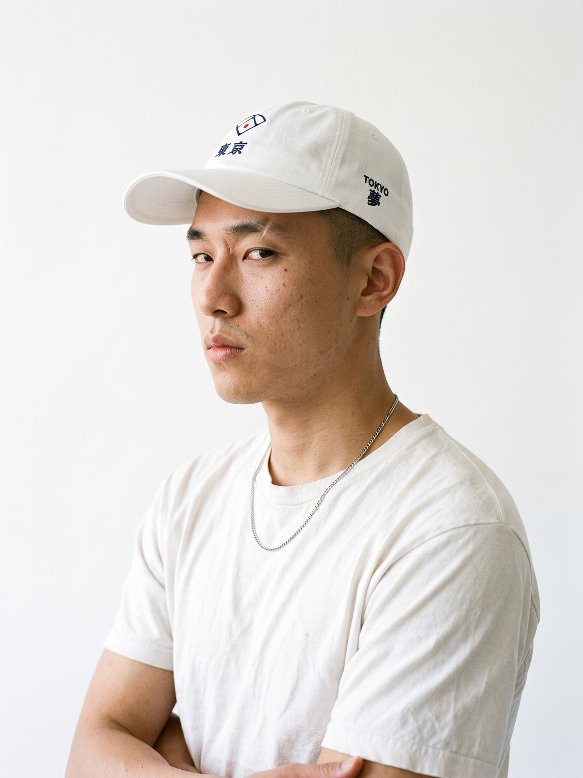 Side view of the 5C5V Tokyo Diamond Japanese baseball cap in white, TOKYO above 夢 (dream) embroidered on the left side