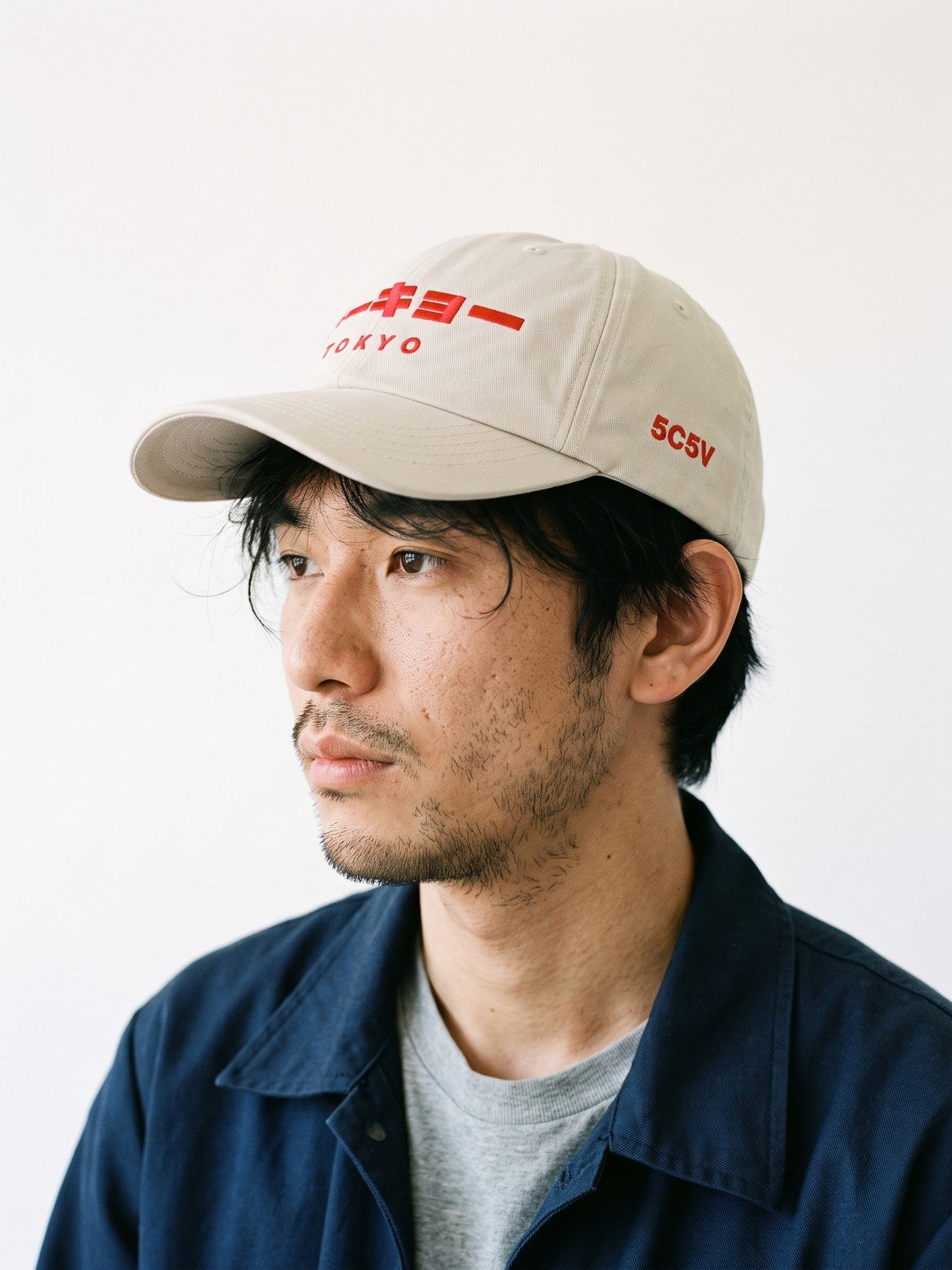 Side view of the 5C5V Tokyo Katakana Japanese baseball cap in stone, 5C5V in red embroidered on the left side
