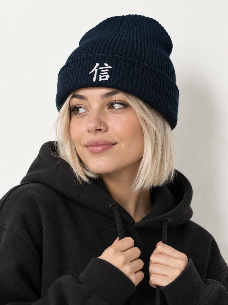 Model with a platinum bob in a black hoodie wearing the Oxford Navy 5C5V Yokohama Trust 信 ribbed beanie, three-quarter view