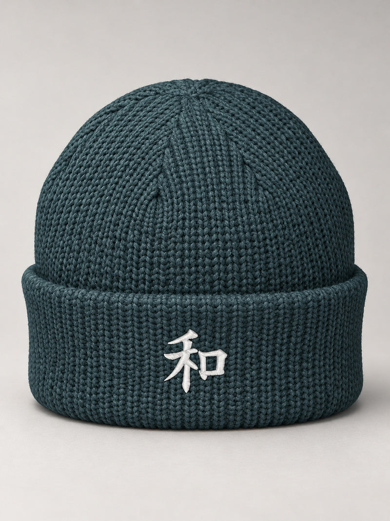 Petrol Blue Kyoto Harmony 和 fisherman beanie with the white satin-stitch 和 embroidered on the cuff, front view