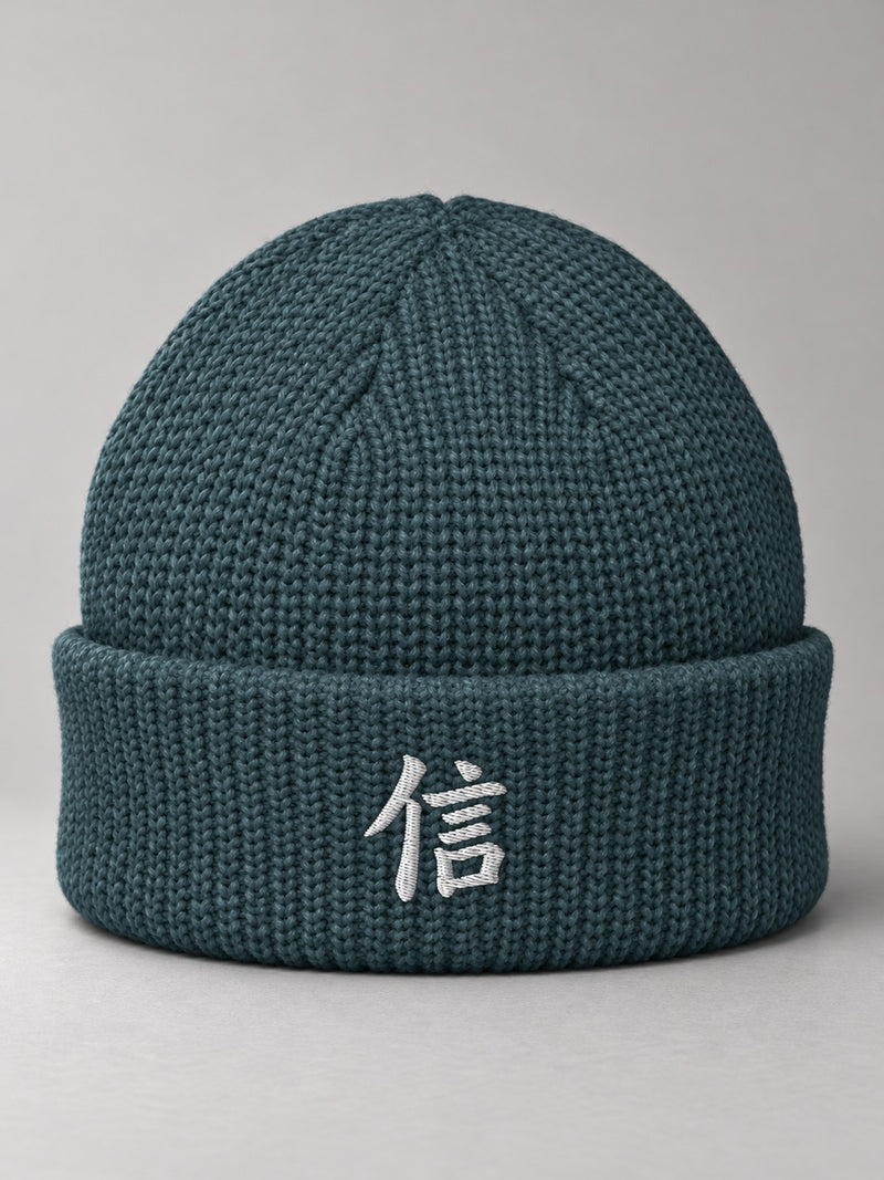 Petrol Blue Yokohama Trust 信 fisherman beanie with the white satin-stitch 信 embroidered on the cuff, front view
