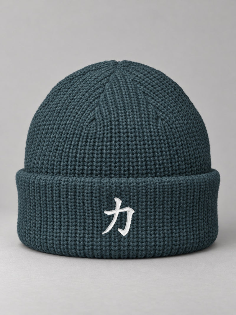 Petrol Blue Osaka Strength 力 fisherman beanie with the white satin-stitch 力 embroidered on the cuff, front view