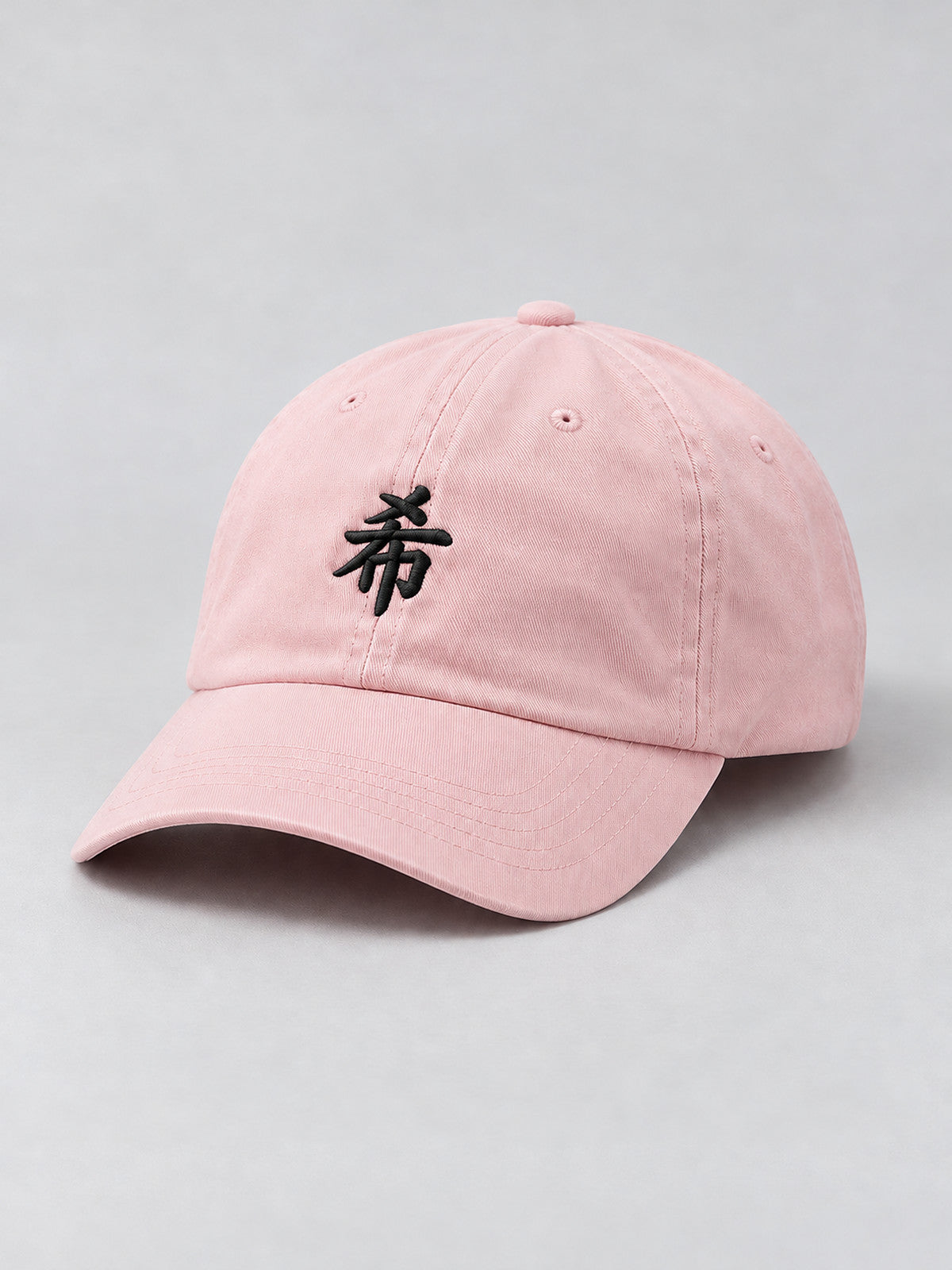 Pastel pink First Light 希 cap, three-quarter view