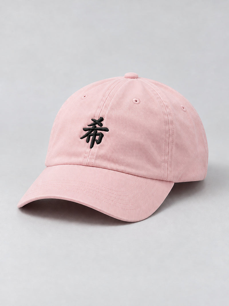 Pastel pink First Light 希 cap, three-quarter view