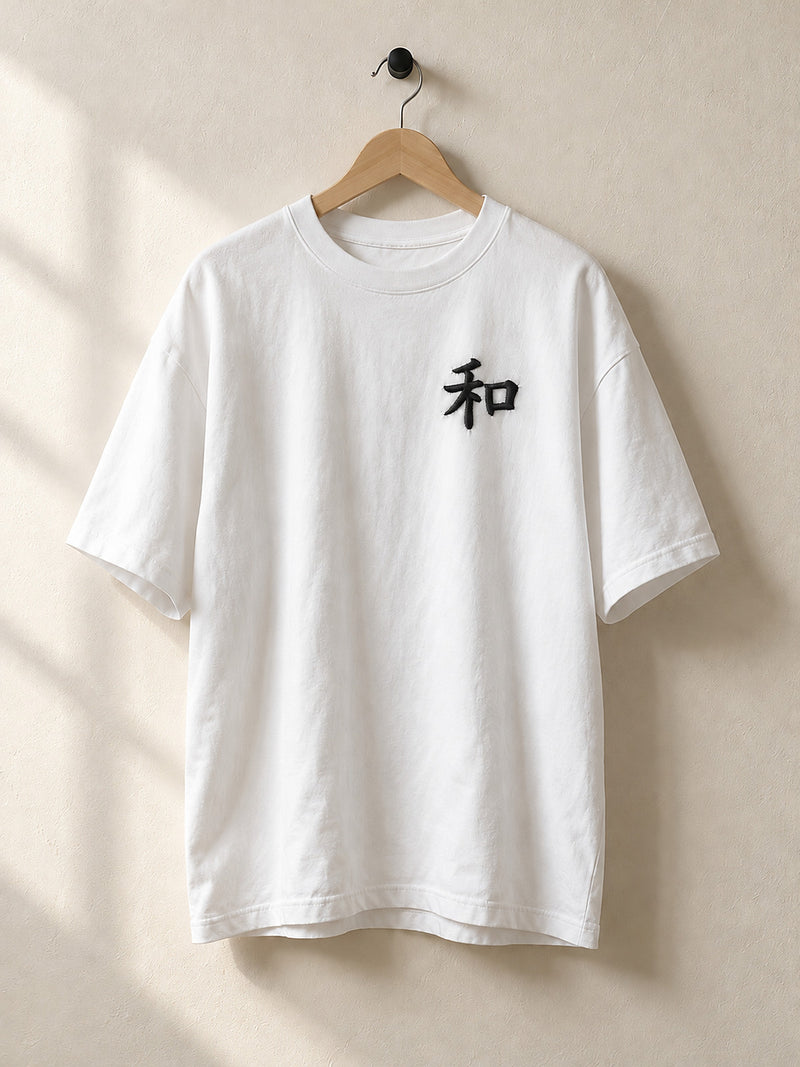 White Kyoto Harmony 和 premium oversized tee on a wooden hanger, front view