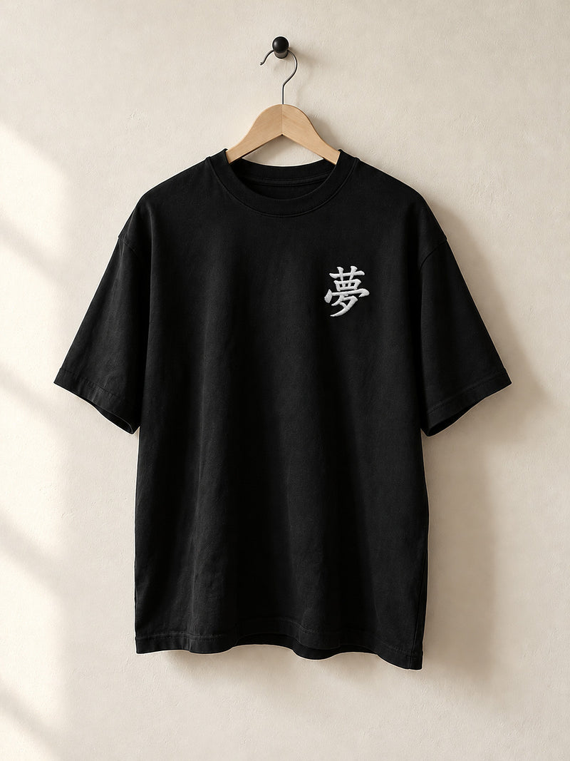Black Tokyo Dream 夢 premium oversized tee on a wooden hanger