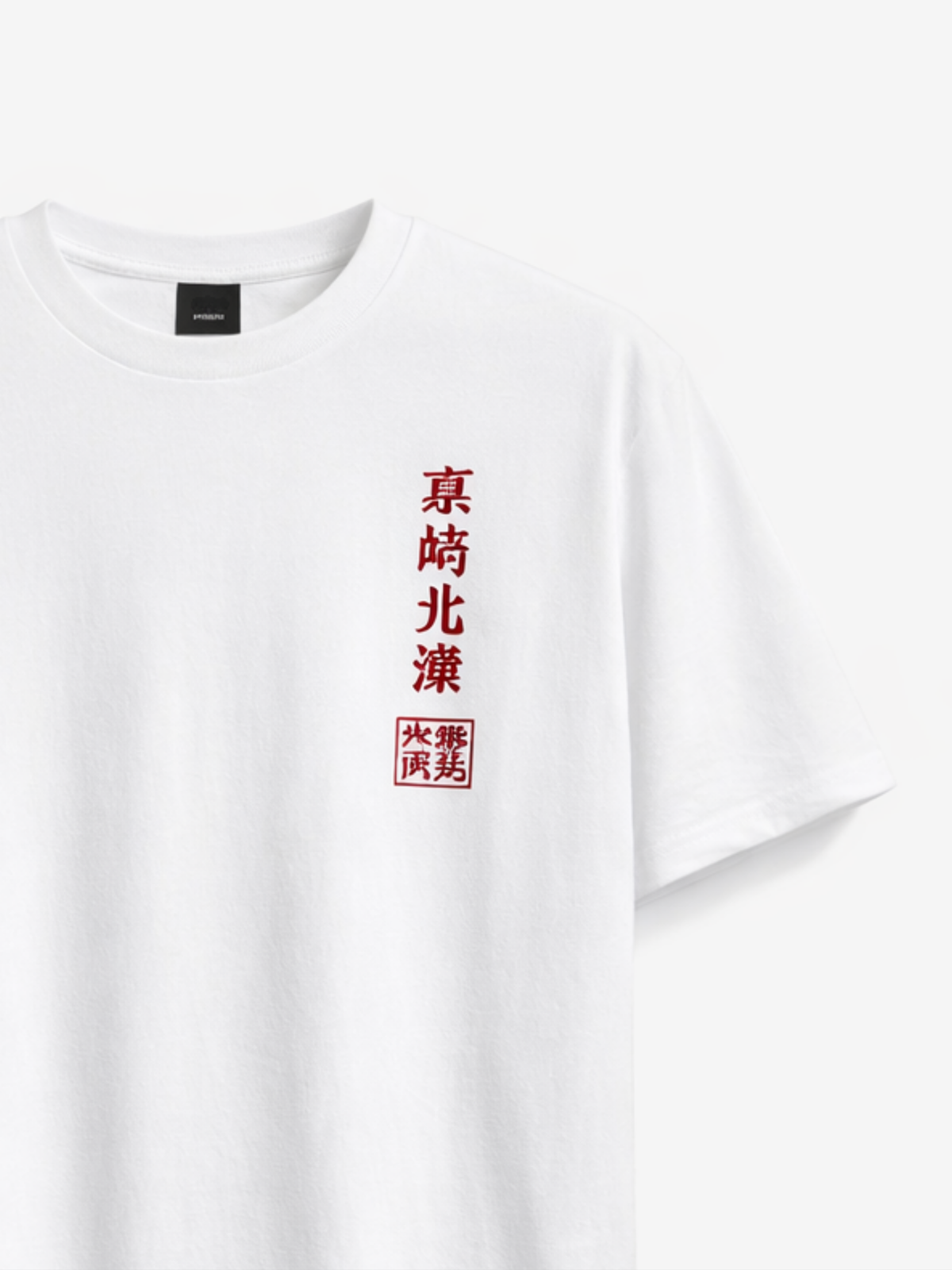 Front view of the white Seán Seachtain Hokusai tee, showing the red vertical Japanese kanji calligraphy and the 五哲彩堂 studio seal printed at centre chest — Edo-period ukiyo-e woodblock homage.
