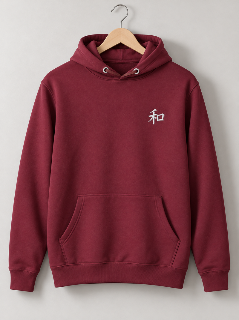 Maroon Kyoto Harmony 和 hoodie on a wooden hanger, front view with the small white embroidered 和 on the left chest