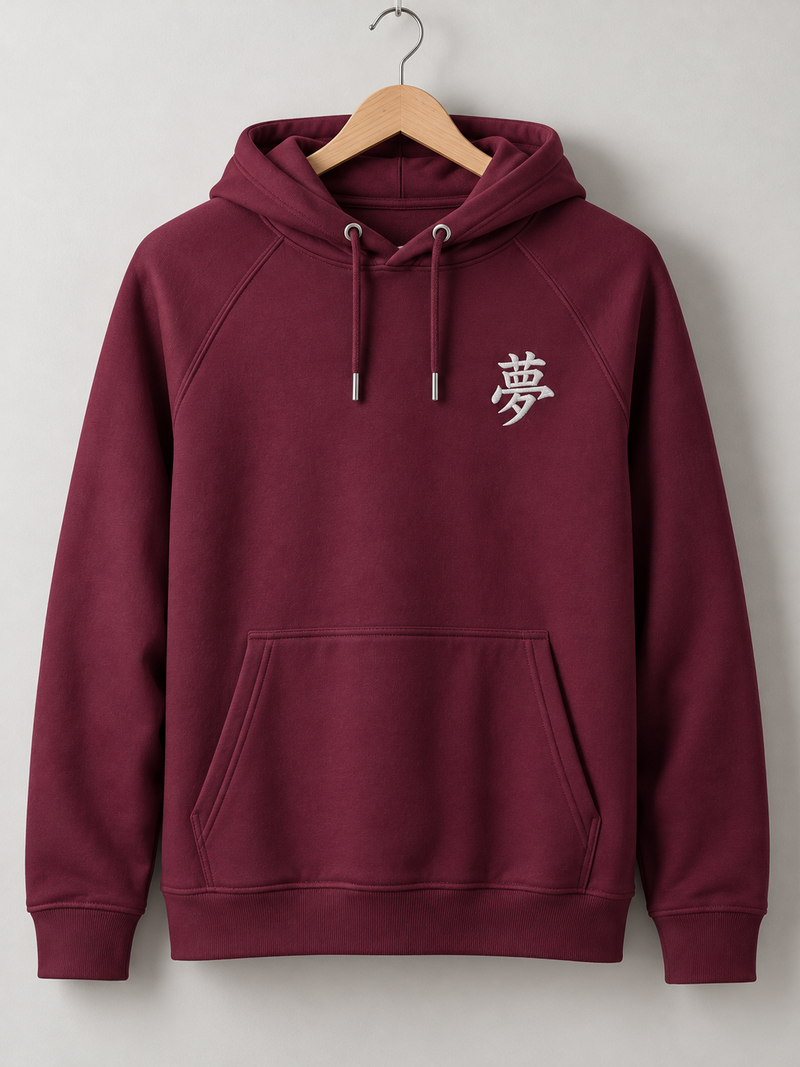 Burgundy Tokyo Dream 夢 hoodie on a wooden hanger, front view with the small white embroidered 夢 on the left chest
