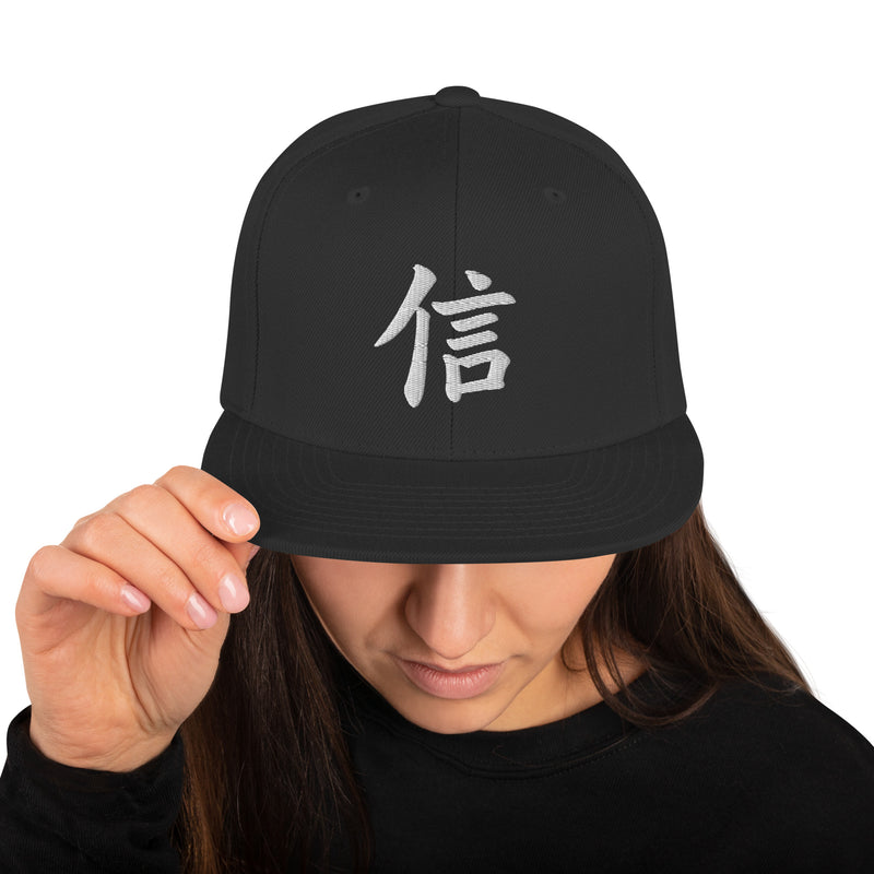 Black Yokohama Trust 信 snapback, front view, white 信 kanji embroidered on the front