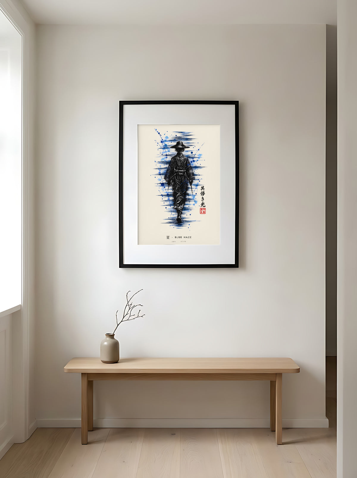 Edo Blue Haze 夏 framed print: a lone traveller in a straw hat in black ink with splashes of blue, black frame in a Japandi entryway above an oak bench