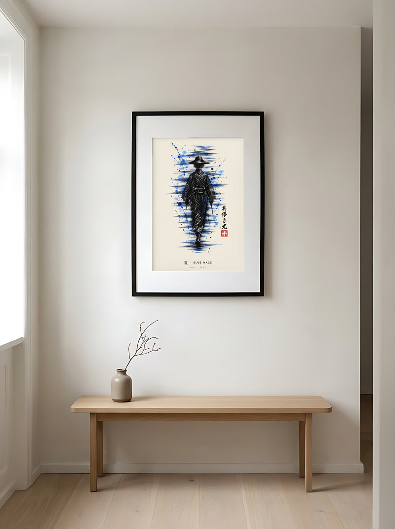 Edo Blue Haze 夏 framed print: a lone traveller in a straw hat in black ink with splashes of blue, black frame in a Japandi entryway above an oak bench