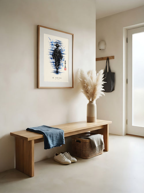 Edo Blue Haze 夏 framed print: a lone traveller in a straw hat in black ink with splashes of blue, red oak frame in an entrance hall