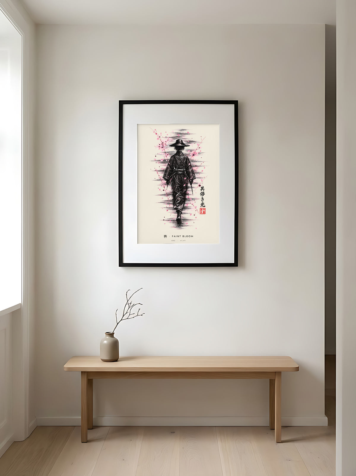 Edo Faint Bloom 春 framed print: a lone traveller in a straw hat in black ink with falling pink blossom, black frame in a Japandi entryway above an oak bench