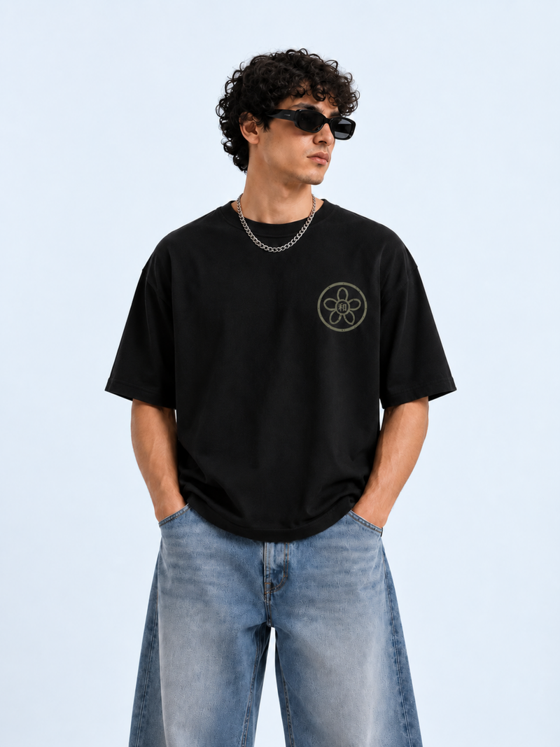 Model wearing the black Kyoto Harmony 和 graphic tee, front view with the sakura kamon and 和 chest print