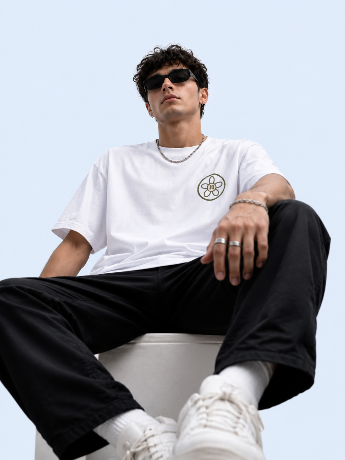 Model sitting in the white Kyoto Harmony 和 graphic tee