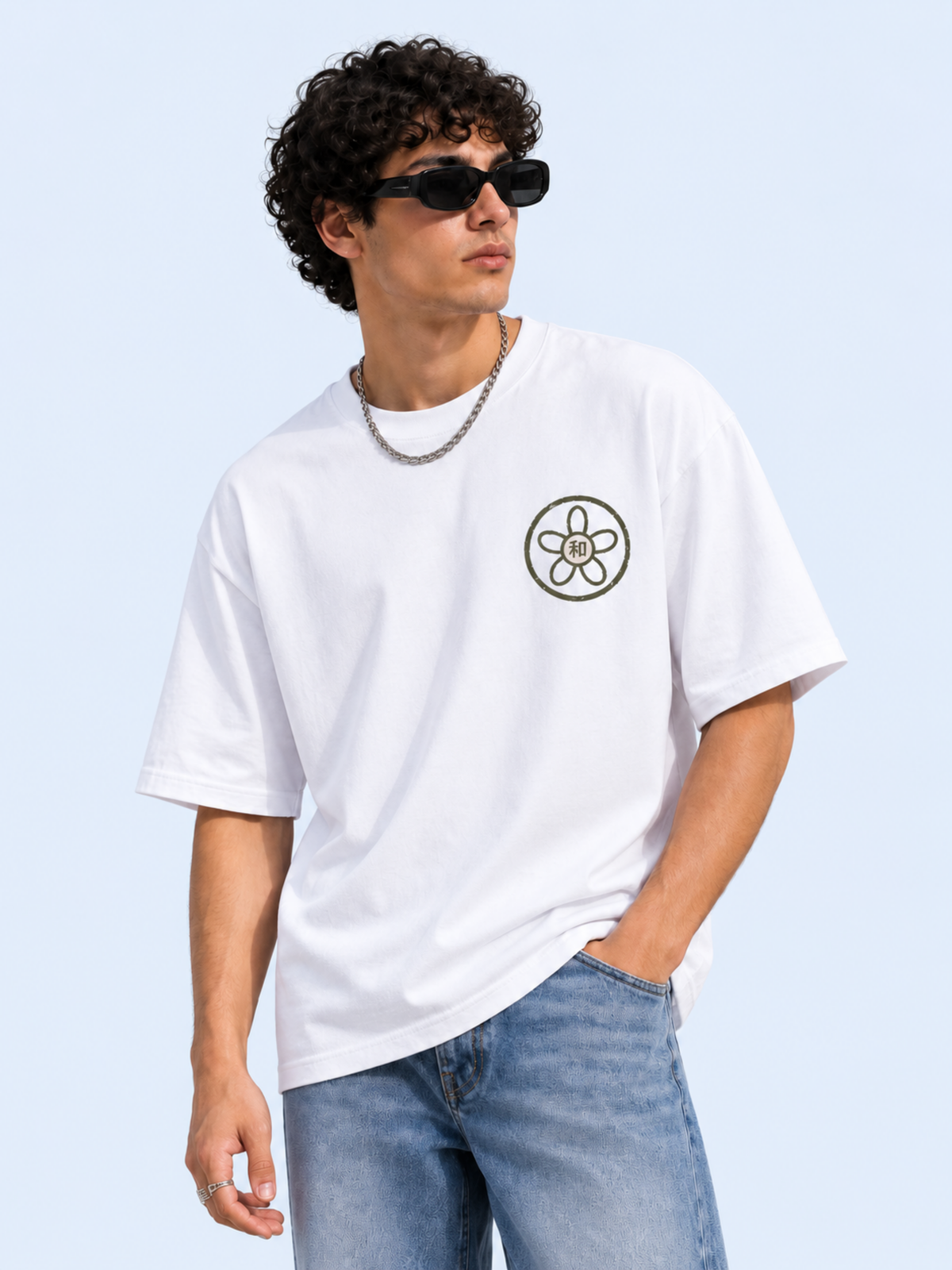 Model wearing the white Kyoto Harmony 和 graphic tee, front view with the olive sakura kamon and 和 chest print