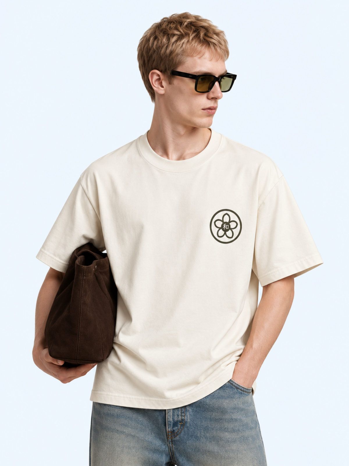 Model wearing the vintage white Kyoto Harmony 和 graphic tee, front view with the sakura kamon and 和 chest print