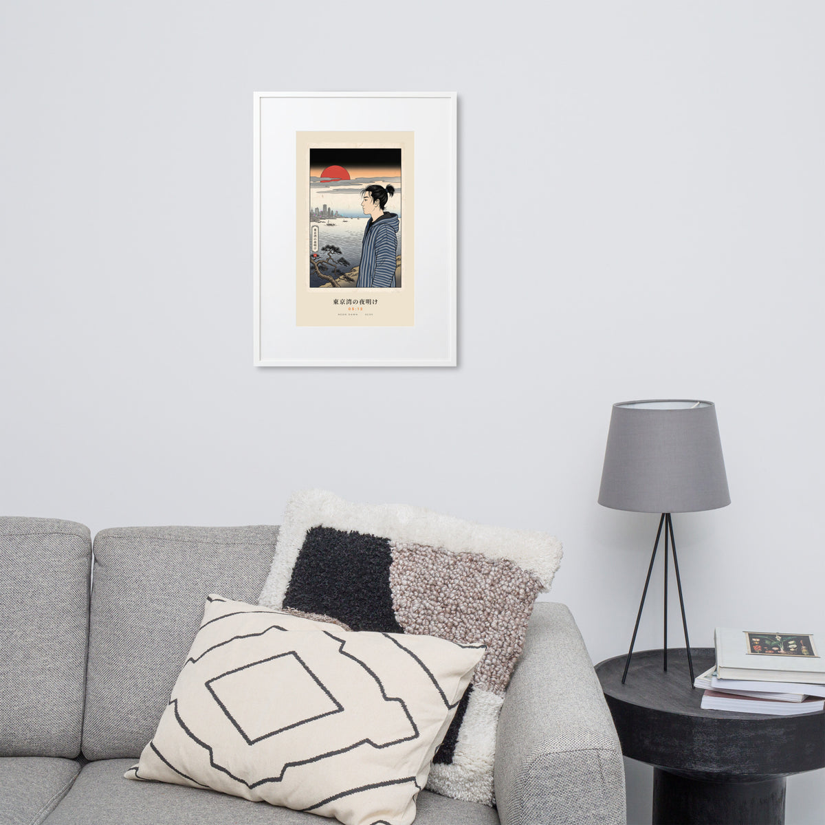 White-framed Tokyo Bay 東京湾 print, 50×70 cm: woodblock-style dawn over Tokyo Bay, red sun, on a wall over a sofa