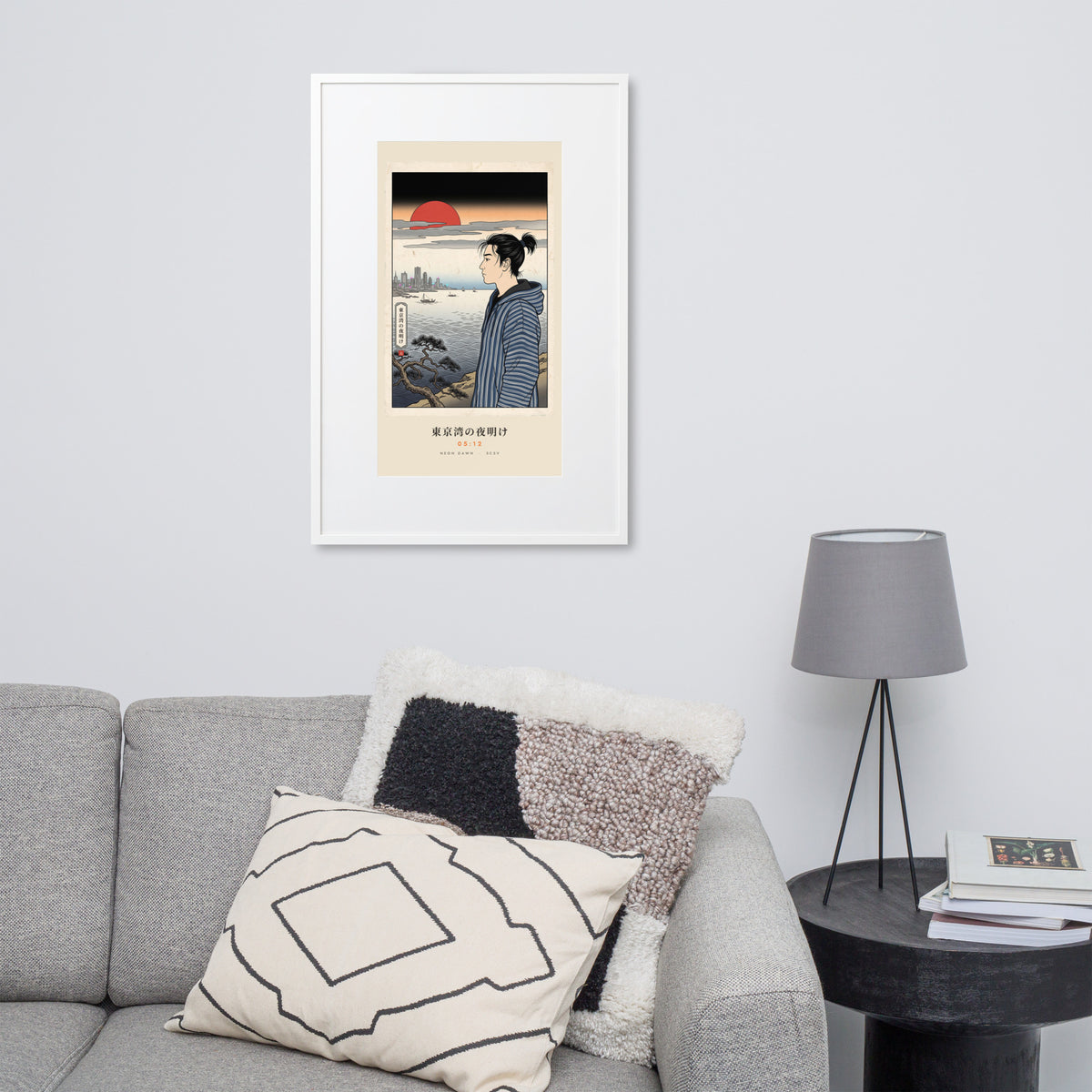 White-framed Tokyo Bay 東京湾 print, 61×91 cm: woodblock-style dawn over Tokyo Bay, red sun, on a wall over a sofa