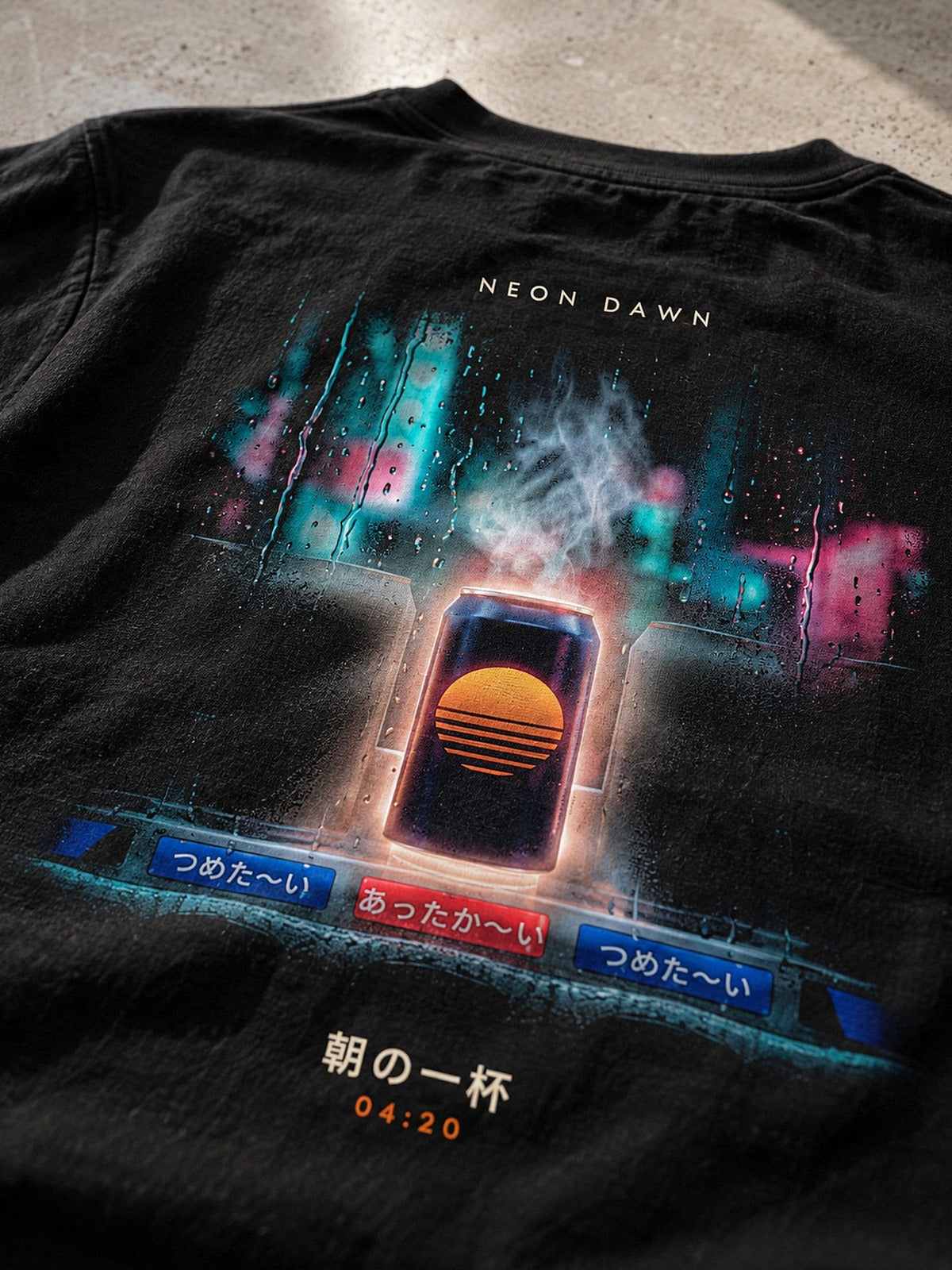 Detail of the Neon Dawn Asa no Ippai 朝の一杯 back print on heavyweight black cotton, the glowing can and the あったか〜い vending machine labels in focus
