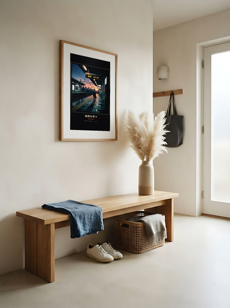 Shihatsu 始発 framed print: a commuter waiting for Tokyo's first train at sunrise, red oak frame in a Japandi entrance hall