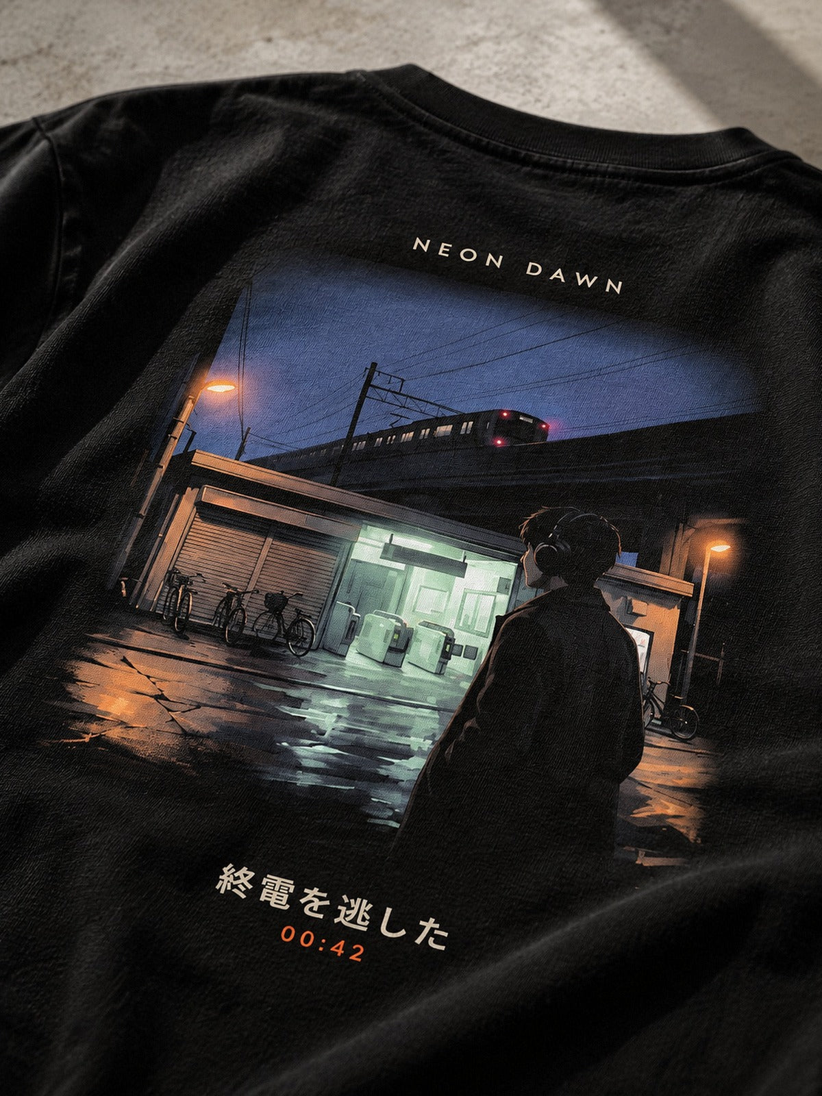 Detail of the Shūden back print: the last train pulling away on the viaduct and a lone figure in headphones outside the station
