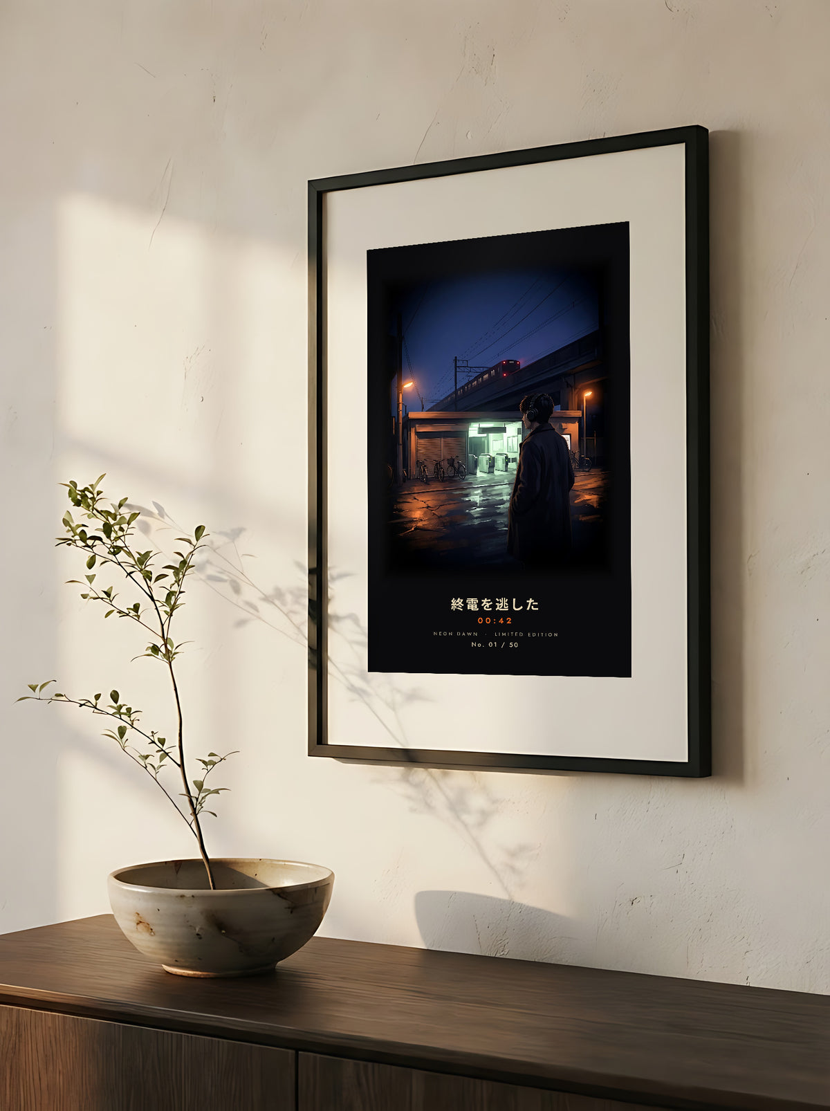 Shūden 終電 limited edition framed print: a young man in headphones outside a Tokyo station at midnight as the last train pulls away, close-up of the black frame and white mat