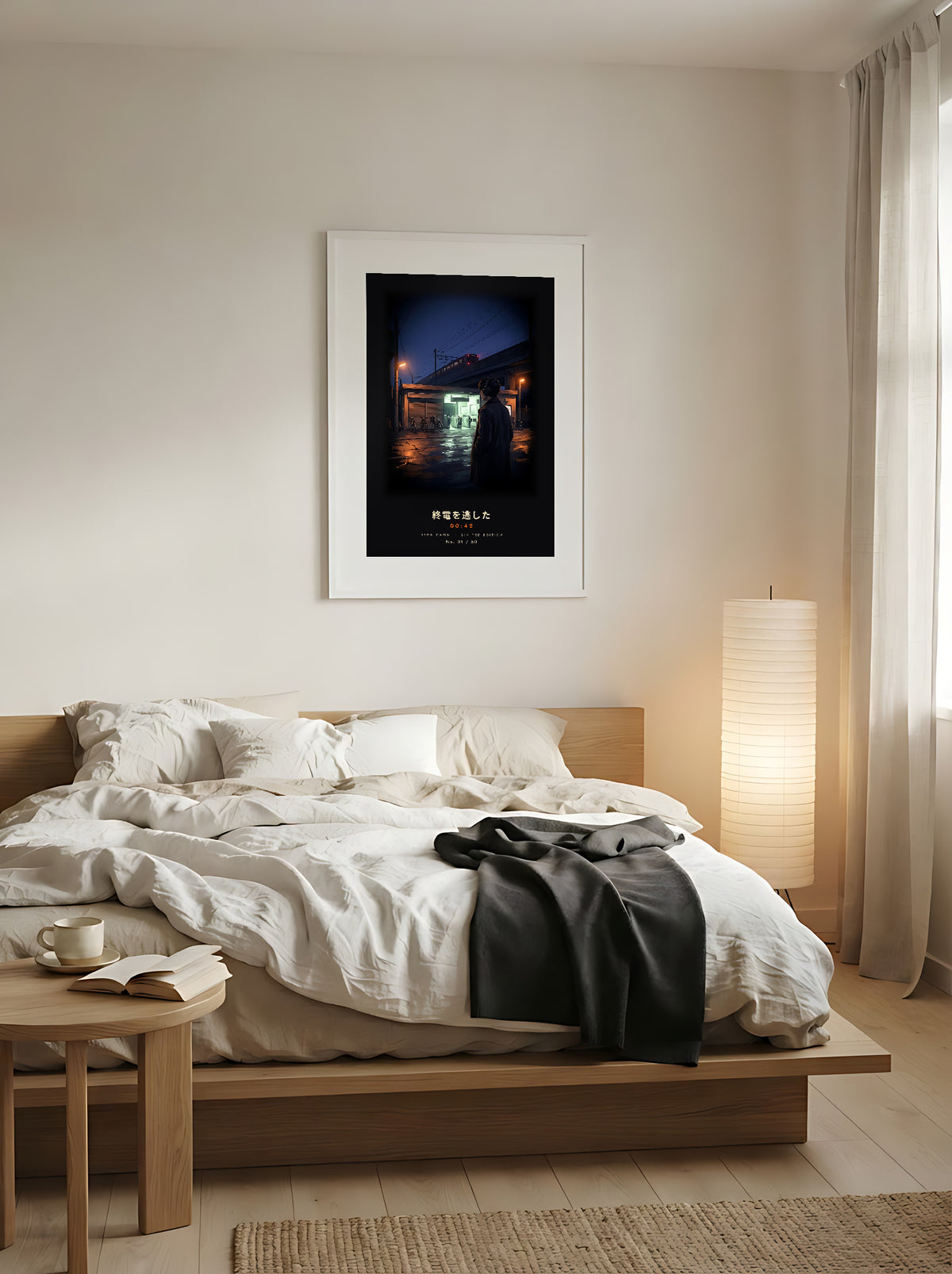 Shūden 終電 limited edition framed print: a young man in headphones outside a Tokyo station at midnight as the last train pulls away, white frame above a low oak bed in a Japandi bedroom