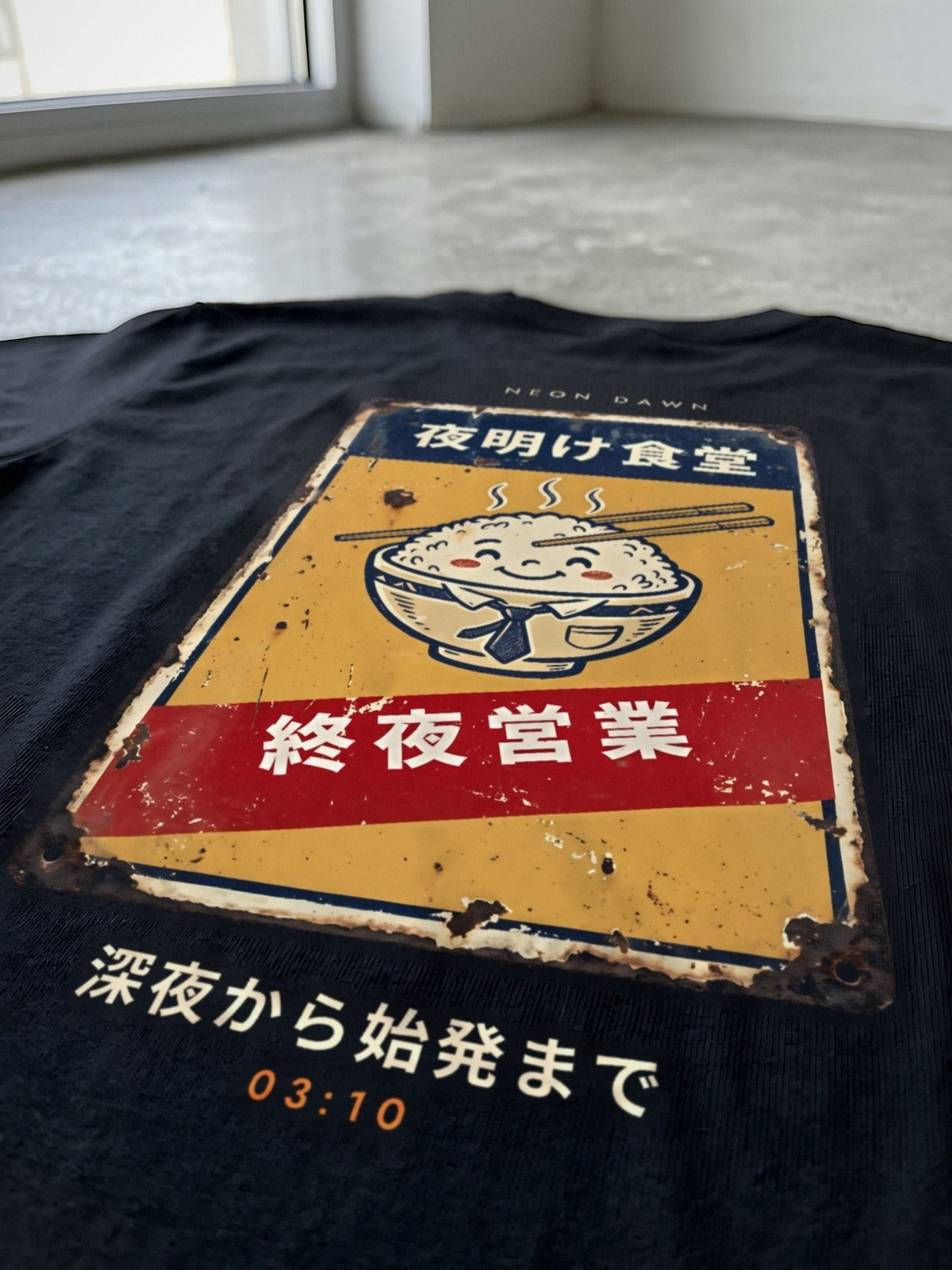 Detail of the Neon Dawn Shuya Eigyo 終夜営業 back print on heavyweight black cotton, the rice bowl and the red 終夜営業 banner in focus