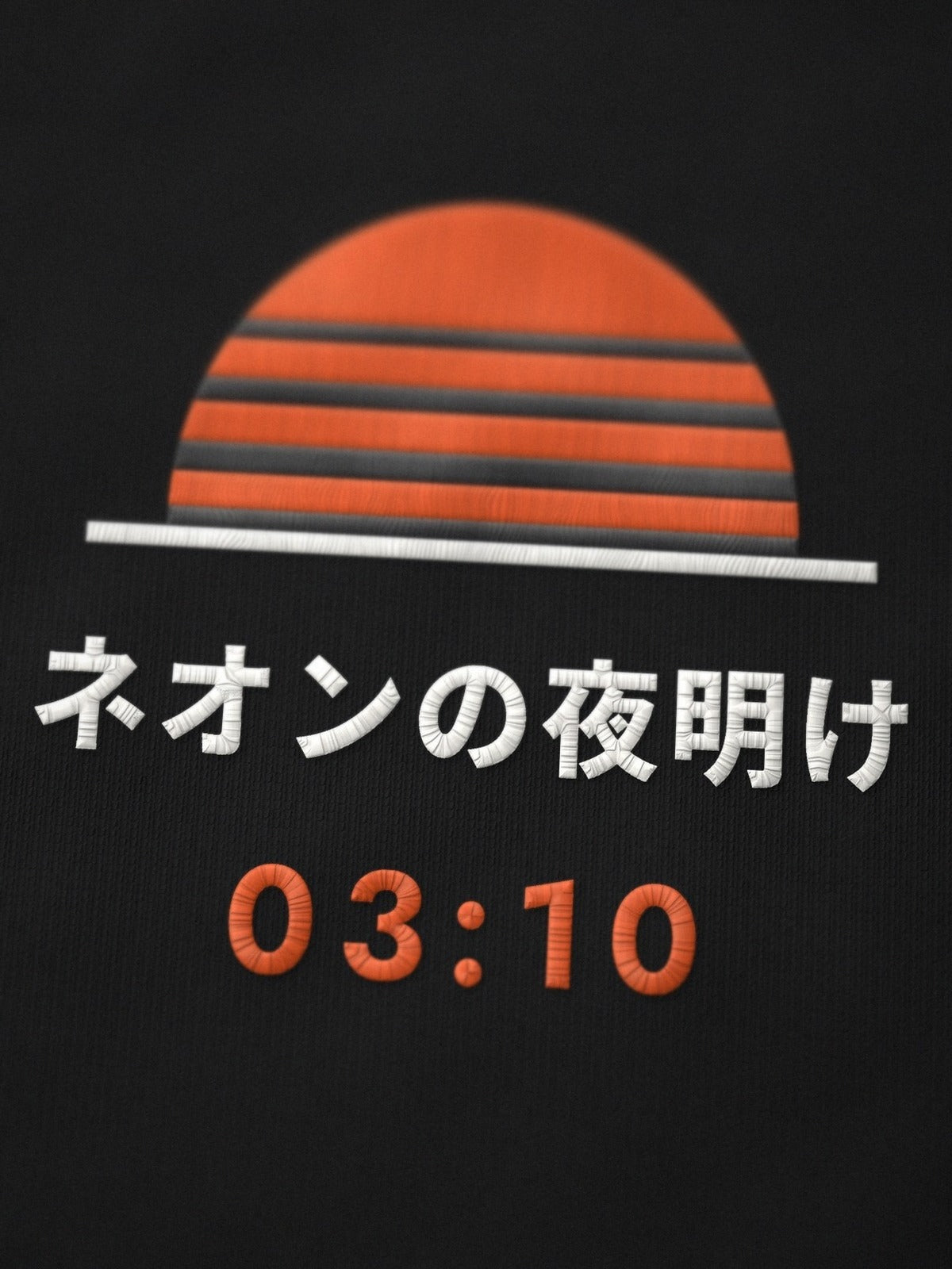 Close-up of the embroidered Neon Dawn sun on the Shuya Eigyo 終夜営業 black tee, ネオンの夜明け and 03:10 stitched in orange and white thread