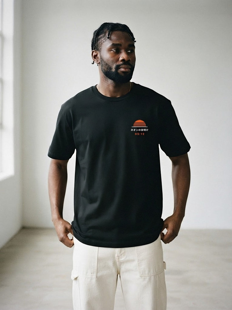 Model wearing the Neon Dawn Tokyo Bay 東京湾 black tee, front view with the embroidered 05:12 Neon Dawn sun on the chest