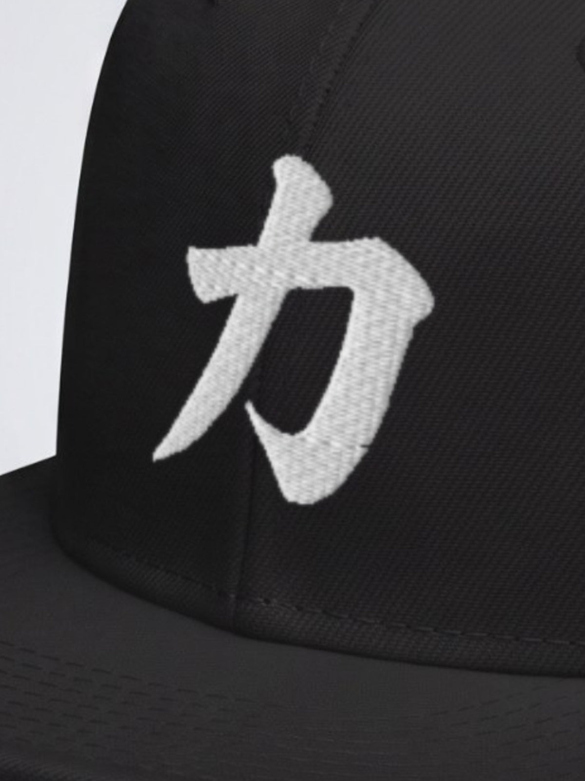 Close-up of the brush-stroke 力 (strength) embroidery on the Fude Edition