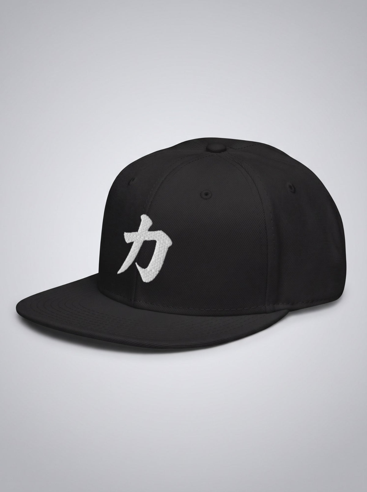Fude Edition snapback in black, three-quarter view showing the flat brim