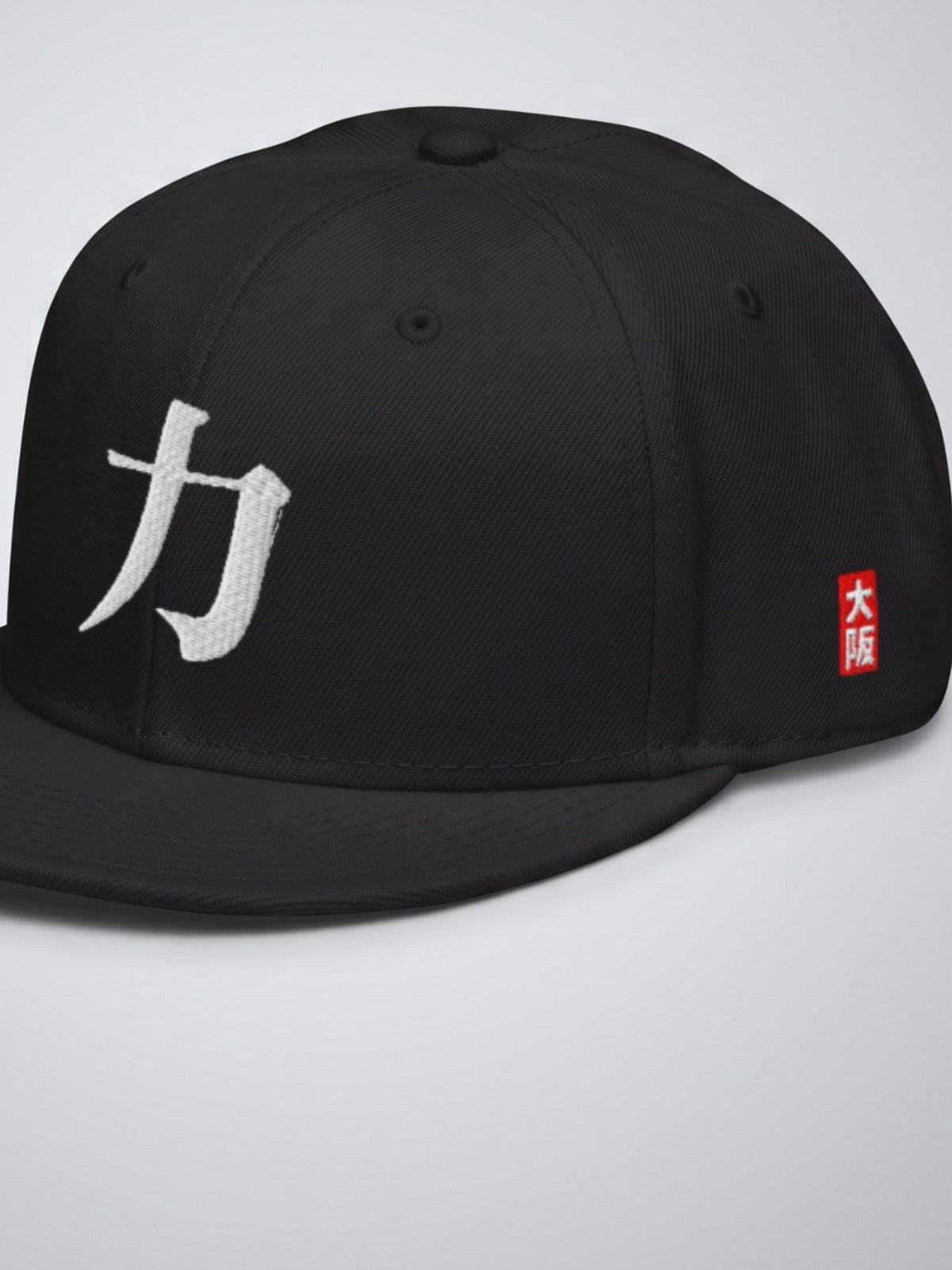 Close-up of the 力 (strength) embroidery and the red 大阪 (Osaka) hanko seal