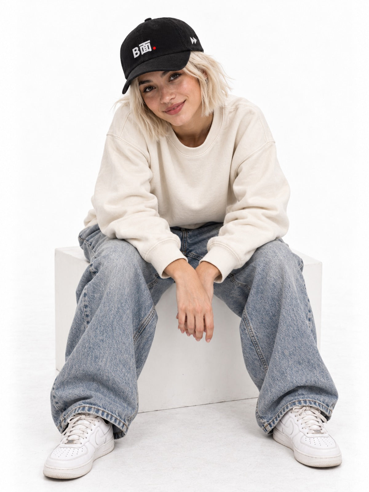 B面 Japanese Corduroy Baseball Cap in Black by 5C5V, on model, seated