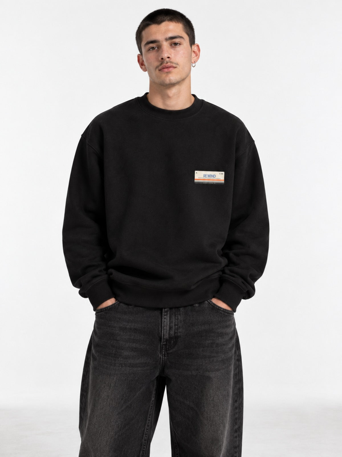 Kasetto カセット C-60 Japanese Tape Label Sweatshirt in black by 5C5V, on model, front view