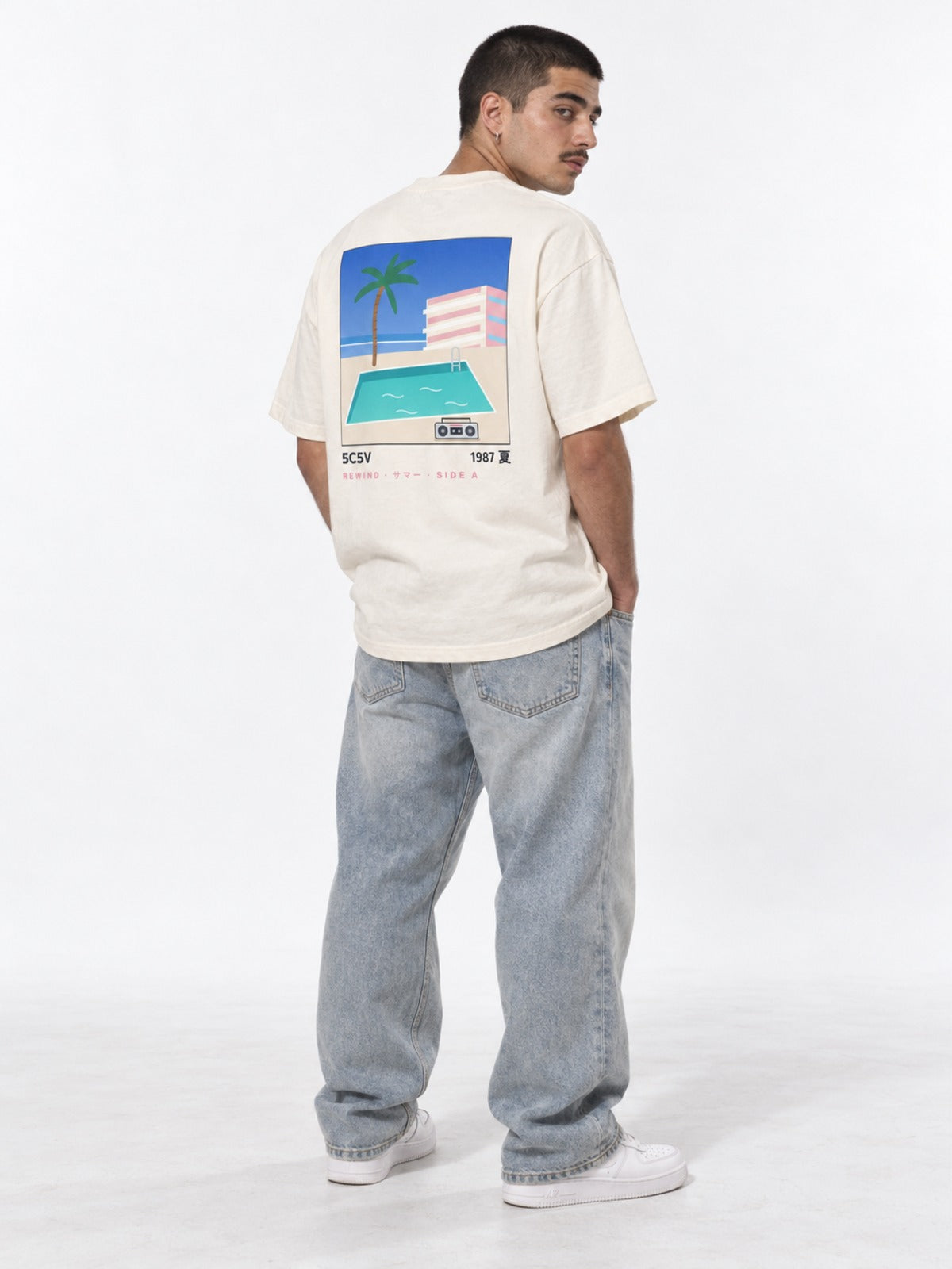 City Pop シティポップ 1987 Japanese Summer T-Shirt in vintage white by 5C5V, on model, back view