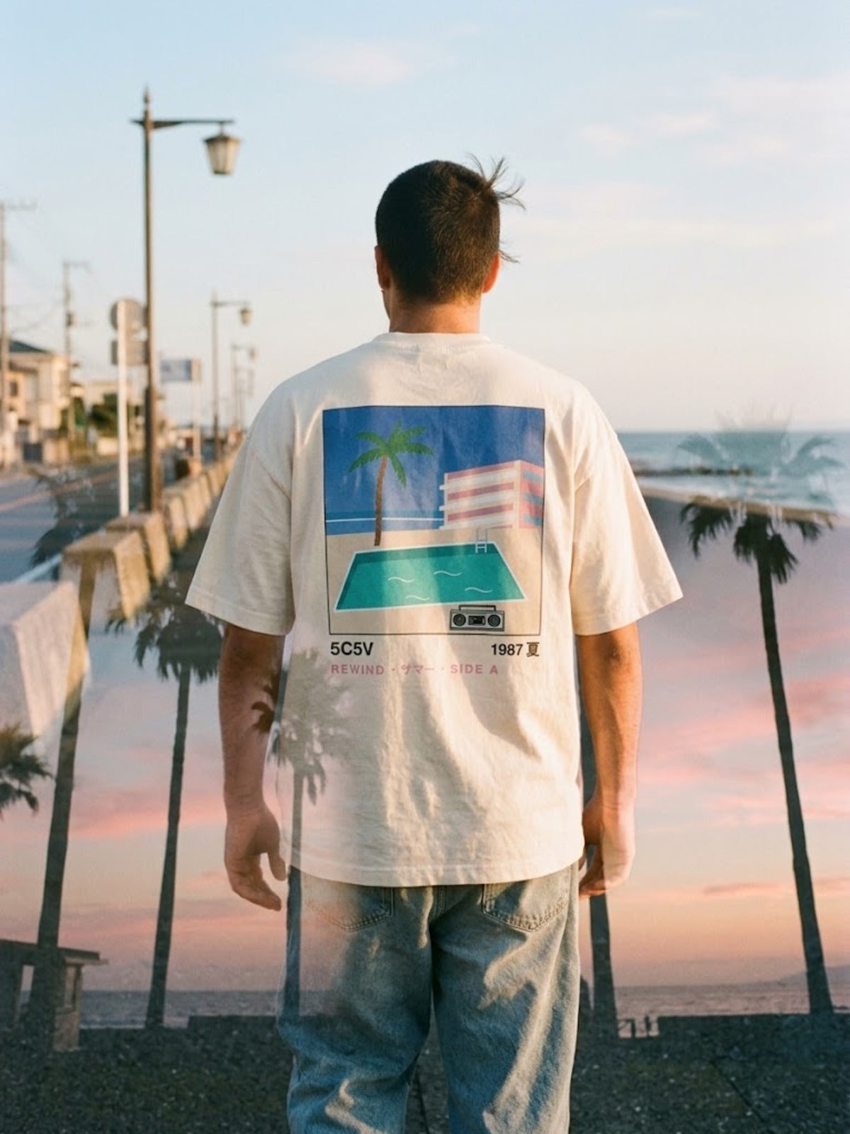City Pop シティポップ 1987 Japanese Summer T-Shirt by 5C5V on a seafront at golden hour