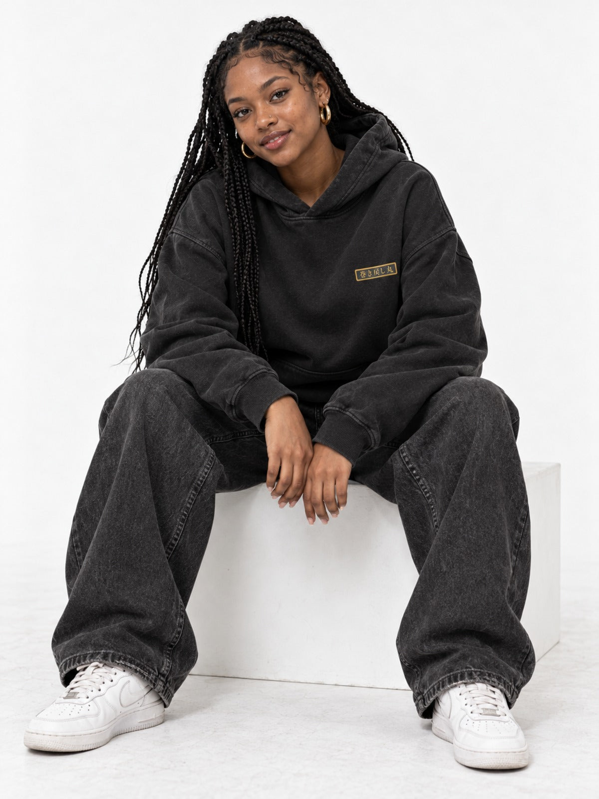 Dekotora デコトラ Japanese Black Hoodie in faded vintage black by 5C5V, on model, seated