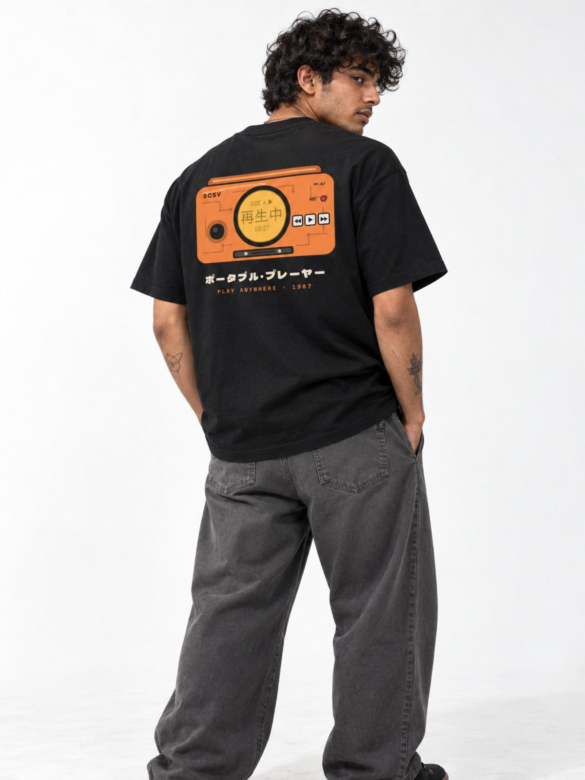 Saisei-chū 再生中 Japanese Cassette Player T-Shirt in black by 5C5V, on model, back view